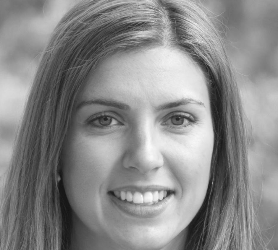 Professional headshot of market research specialist