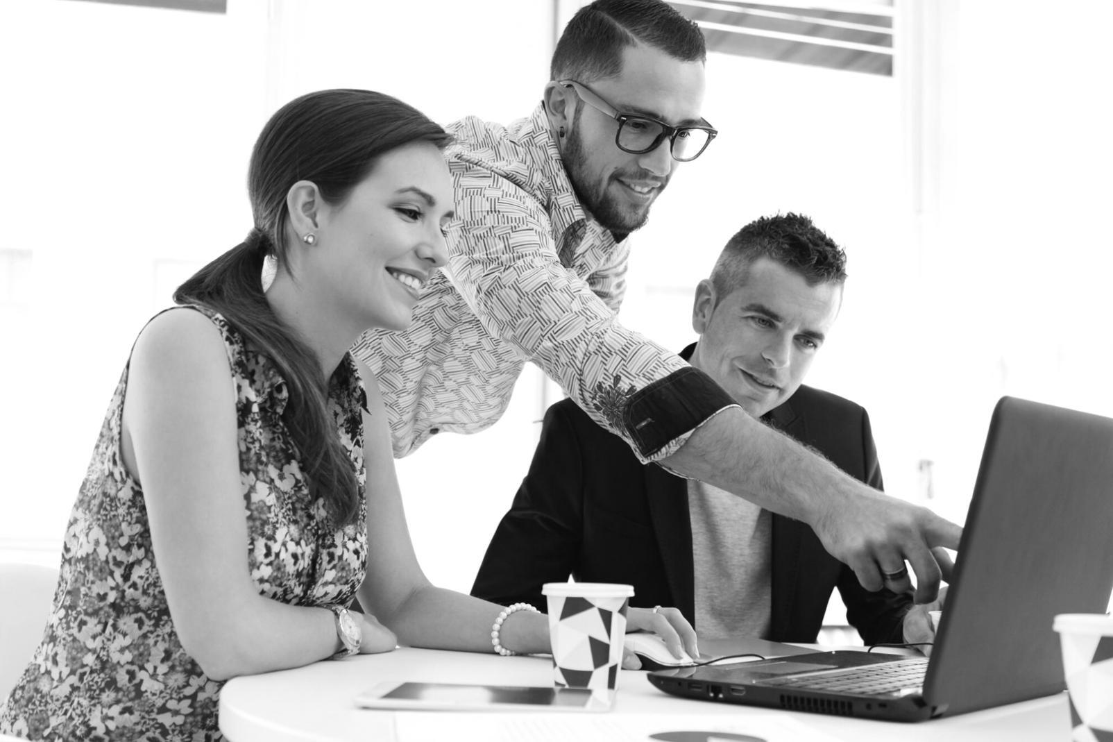 Business professionals reviewing financial forecasting methodology and planning documents